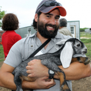 Steven Nuñez with a baby goat, A2F alum Texas Steven Nuñez